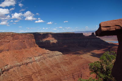 Scenic view of mountains against blue sky