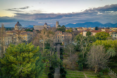 High angle view of trees and buildings against sky