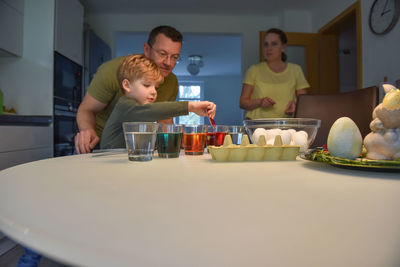 A family dyes eggs for easter