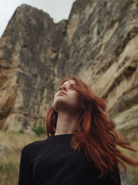 Portrait of young woman with eyes closed