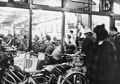 People on motorcycle in city