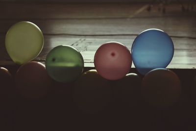Close-up of colorful balloons arranged in row