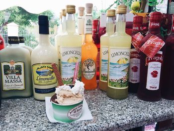 Close-up of various bottles on shelf