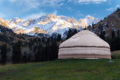 Scenic view of snowcapped mountains against sky during winter