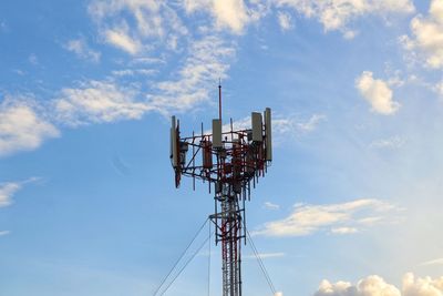 Low angle view of communications tower against sky