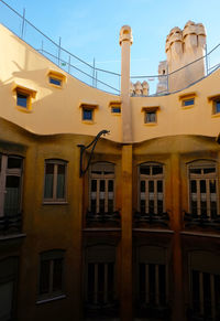 Low angle view of residential building against sky