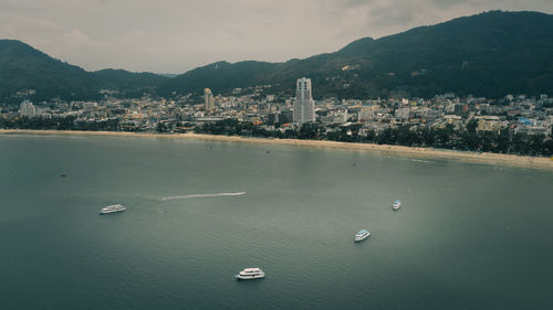 Aerial view the sea with passengers ship and phuket city background