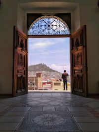 Entrance of building against sky in city