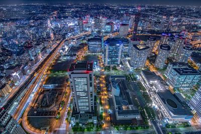 High angle view of illuminated city buildings at night