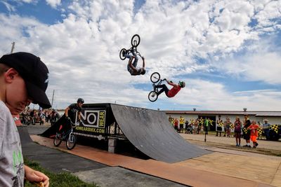 Man skateboarding on skateboard against sky