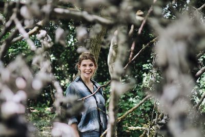 Portrait of young woman standing outdoors