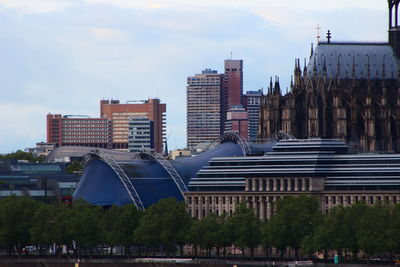 Buildings in city against sky