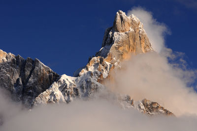 Low angle view of majestic mountain against sky