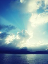 Scenic view of sea against cloudy sky