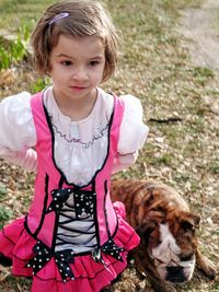 Portrait of cute girl with dog