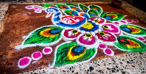 High angle view of multi colored pencils on paper