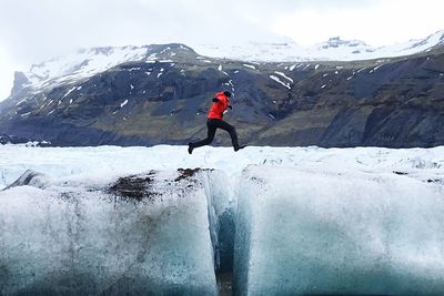 Full length of person on snowcapped mountains during winter