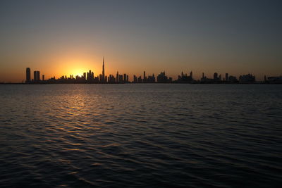 Dubai slyline from dubai creek harbour and dubai canal to downtown and business bay, uae