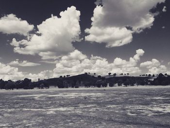 Scenic view of landscape against cloudy sky