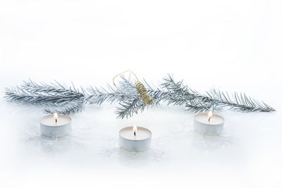 Close-up of christmas decorations over white background