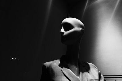 Close-up of mannequin against wall