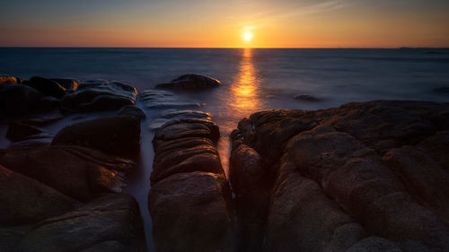 Scenic view of sea against sky during sunset