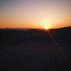 Scenic view of landscape at sunset