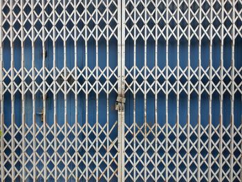 Full frame shot of metal fence against building