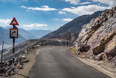 Empty road along countryside landscape