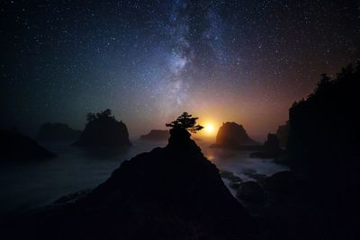 Scenic view of sea against sky at night