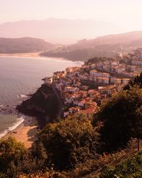 High angle view of townscape by sea