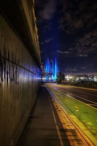Illuminated bridge against sky at night