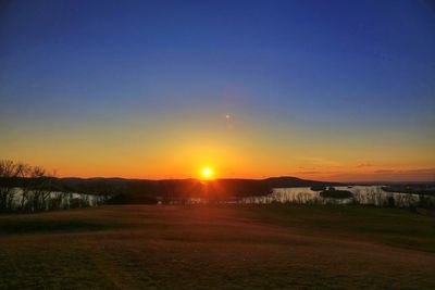 Scenic view of landscape at sunset