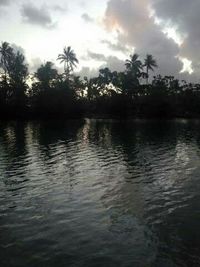 Scenic view of lake against cloudy sky