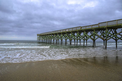 Pier over sea against sky