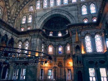 Low angle view of illuminated ceiling of building