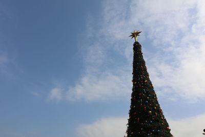 Low angle view of christmas tree against sky