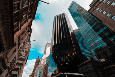 Low angle view of buildings in city against sky