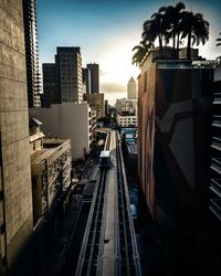 High angle view of railroad tracks amidst buildings in city