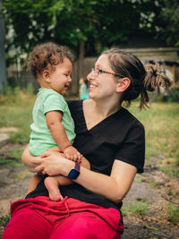 Mother and daughter smiling
