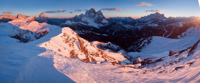 Scenic view of snow covered mountains against sky