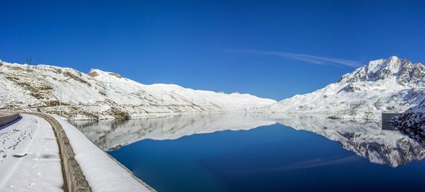 Scenic view of mountains against clear blue sky