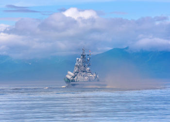 Russian warship going along the coast of kamchatka