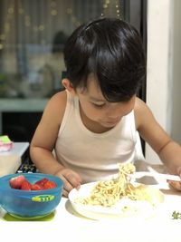 Midsection of woman having food in plate