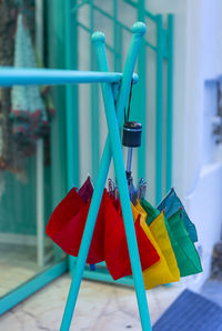 Close-up of multi colored flags hanging against building