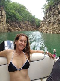 Portrait of smiling young woman in boat