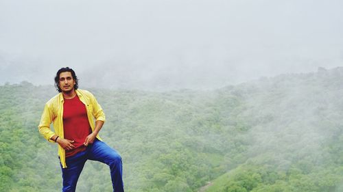 Portrait of man standing on mountain