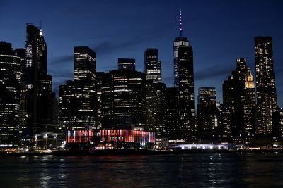 Illuminated buildings in city at night