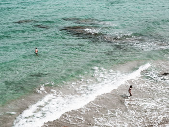 High angle view of man surfing in sea