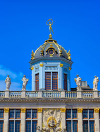 Low angle view of building against blue sky